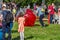 Entertainment of zorbing in the park. Children rolling downhill inside an orb sphere. Enjoy of childhood.