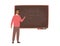 Enthusiastic African American male school teacher, college professor or lecturer standing beside chalkboard, holding