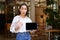 Enthusiastic asian woman shows okay sign, tablet screen, looks impressed, recommends smth