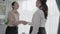 Enthusiastic businesswoman handshake after successful business agreement.