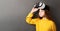 Enthusiastic little girl wearing virtual reality headset modern innovation device isolated on gray