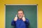 Enthusiastic male teacher giving double thumbs up