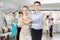 Enthusiastic teenagers performing waltz during group dance lesson