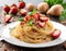 An enticing plate of spaghetti carbonara ,but instead of bacon use diced strawberries