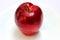 Entire red apple on a white background