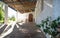 Entrance of abadoned church Ermita de Sant Antoni y Sant Jaume with plant in Cap Blanche, Altea, Spain