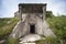 Entrance in abandoned concrete bunker