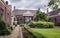 The entrance of the almshouse the green garden in the old center