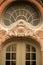 Entrance of an ancient building with glass windows and intricate architectural designs in Stockholm