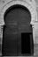 Entrance arch door of the Alhambra in Granada in black and white