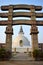 Entrance arch to the stupa Shanti with the stupa in the background in Delhi