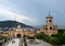 Entrance archway bell tower and city building Holy Trinity Sameba Cathedral Tbilisi Georgia