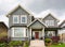 Entrance of average family house with doorsteps to the porch and lawn in front