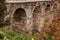 Entrance bridge stone arches of the medieval fortress Koporye