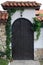 Entrance of building with beautiful arched wooden door outdoors