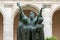 The entrance cloister of Monte Cassino Abbey and the death of Saint Benedict Statue. Italy