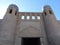 Entrance with decorated towers to Khiva in Uzbekistan.