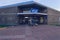 Entrance of Den Helder train station with lighting boxes and flower sale