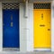 Entrance door in an ancient house, yellow and blue