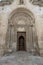 Entrance door of The Romanesque Parrocchia di San Giovanni Battista Parish church in Matera, Italy