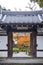 Entrance door to beautiful Japanese maple garden during autumn at Enkoji Temple in Kyoto, Japan