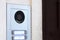 Entrance doorbell on the wall a video camera and remote opening
