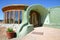 Entrance of an Earthship sustainable house made out of adobe and upcycled glass bottles near Taos in New Mexico, USA