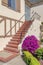 Entrance exterior of a beige house with staircase with bricks at San Francisco, California