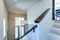 Entrance foyer with white walls and staircase.