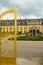 Entrance into the garden of castle in Herrenhaeuser Gaerten in Hannover with golden gate shining