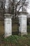 Entrance gate to the old park and house, old stylish gate, large park with old trees