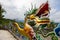 The entrance gate of Xuan Zang Temple at Sun Moon Lake, Taiwan, exudes grandeur with intricate carvings and vibrant colors,