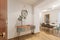 Entrance hall of a house with an orange wooden sideboard