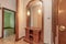 Entrance hall of a residential home with a wooden sideboard with a mirror