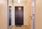 Entrance hallway, entrance door, built-in wardrobes and an open door to the bathroom