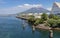 Entrance of Harbor Kagoshima with Sakurajima Port and Aquarium, the erupted Vulcan in the background. Taken from the Ferry.