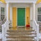 Entrance of home with stairs and green front door