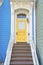 Entrance of a house with ornate columns and wooden doorsteps at San Francisco, California