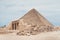 entrance of the mastaba of Seshemnufer IV late 5th Dynasty and the Great Pyramid in background. The Pyramid Fields from Giza to