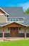 Entrance of new farmer`s house with green lawn in front British Columbia, Canada