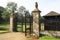 Entrance. ornate wrought iron gate with griffin statues