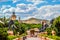 Entrance of The Palace / Lost City /Sun City with stone statues under blue and cloudy sky