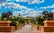 Entrance of The Palace / Lost City /Sun City with stone statues under blue and cloudy sky