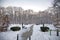 Entrance in a park with the alley cleared of snow 