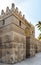 Entrance of public historic Al Hakim Mosque - Enlightened Mosque - and Minaret, Moez Street, Cairo