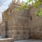 Entrance of public historic Al Hakim Mosque - Enlightened Mosque - and Minaret, Moez Street, Cairo