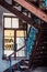 Entrance of a residential building from the inside. Old vintage building from inside. Stairs and window, vertical shot