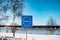 Entrance Sign to Sweden and European Union, multiple stars on blue background. Winter, snowed coast of Balitc sea. Name of country