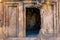 Entrance to an ancient stone tomb carved into the rock