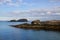 The entrance to Ballintoy harbor on the North Antrim Coast of Northern Ireland with its stone built boathouse on a day in spring